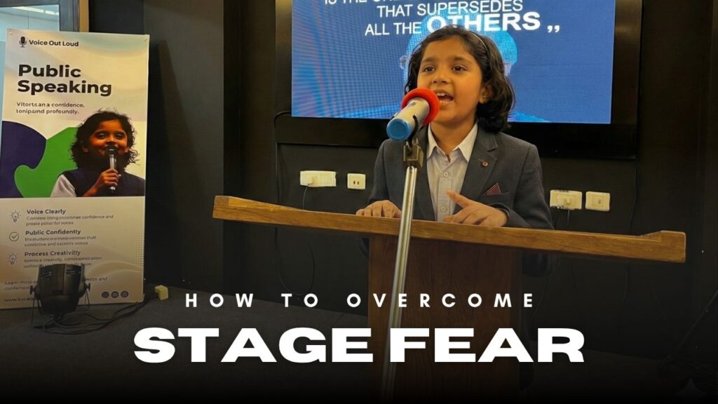 Child overcoming stage fear at public speaking class in Guwahati